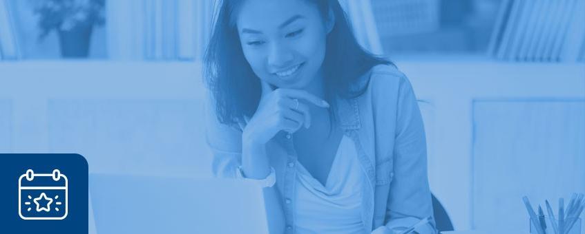 Female student reviewing upcoming activities on her laptop.